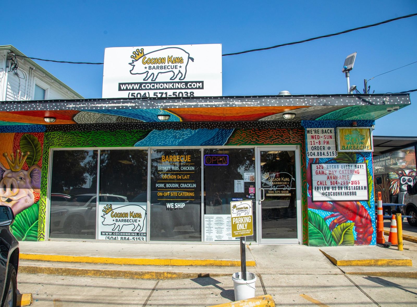The colorful Cochon King BBQ storefront at 5321 Franklin Avenue